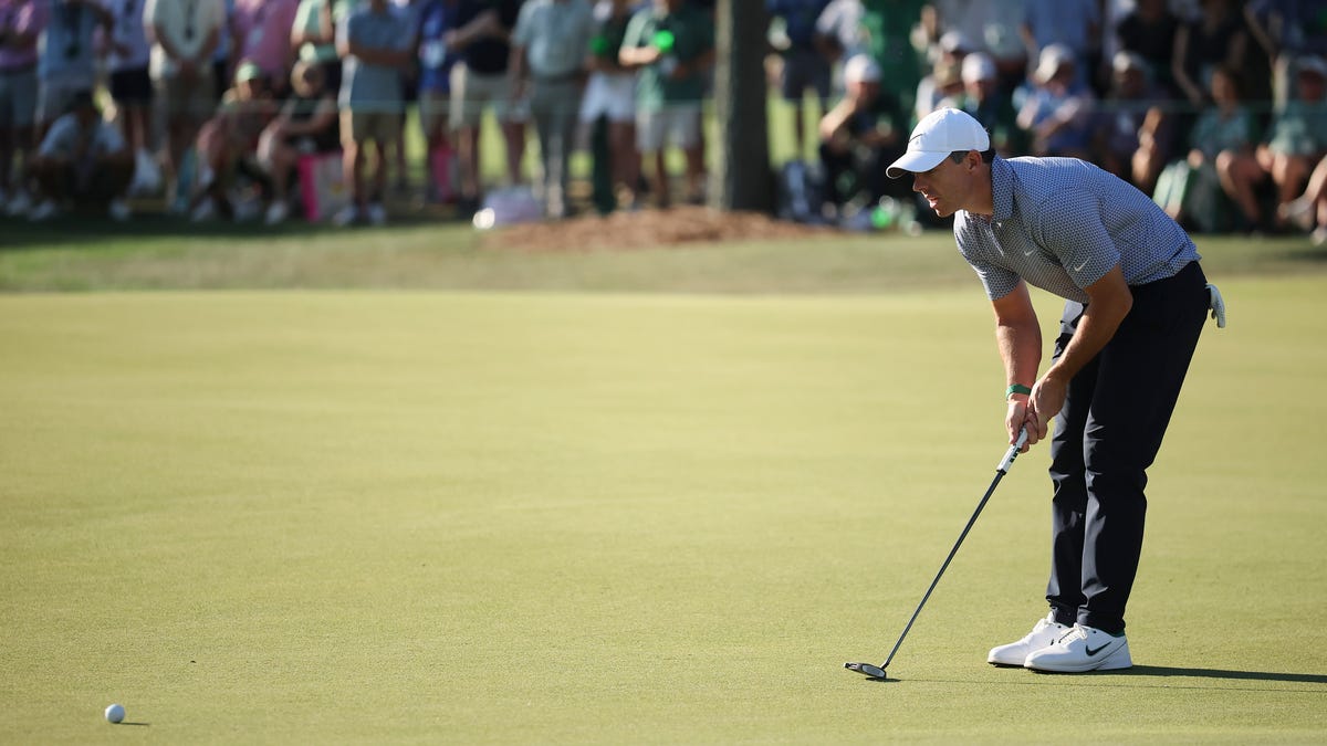 Rory McIlroy let a big lead slip away after a back-nine charge from Cameron Young but remains tied atop the Masters leaderboard at Augusta.