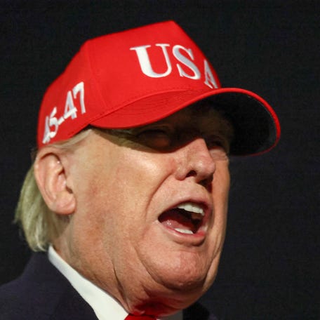 U.S. President Donald Trump speaks to the members of the media after disembarking Air Force One as he arrives at Joint Base Andrews in Maryland, U.S., April 12, 2026.