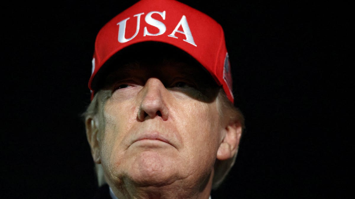 President Donald Trump looks on after disembarking Air Force One as he arrives at Joint Base Andrews in Maryland, U.S., April 12, 2026.