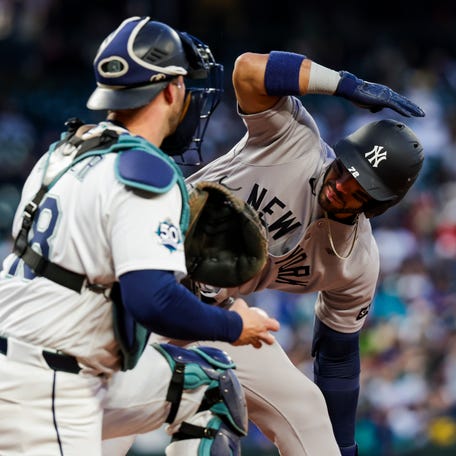 Mar 30, 2026; Seattle, Washington, USA; New York Yankees shortstop Jose Caballero (72) signals for an ABS challenge on a pitch by the Seattle Mariners during the third inning at T-Mobile Park. The strike was overturned and Caballero walked. Mandatory Credit: Joe Nicholson-Imagn Images