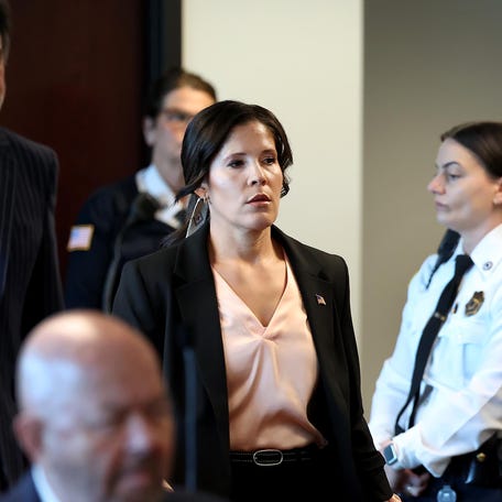 Jennifer Penton enters the courtroom at Middlesex Superior Court in Woburn on Wednesday, April 15.