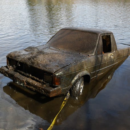 A front-end loader pulled the vehicle to shore.