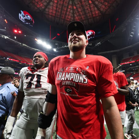 Dec 6, 2025; Atlanta, GA, USA; Georgia Bulldogs offensive lineman Monroe Freeling (57) celebrates after the game against the Alabama Crimson Tide during the 2025 SEC Championship game at Mercedes-Benz Stadium. Mandatory Credit: Brett Davis-Imagn Images