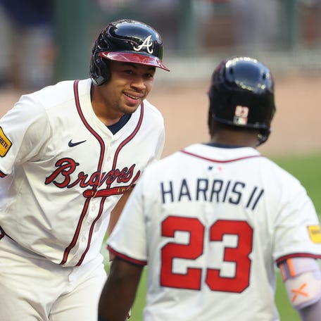 Atlanta's Drake Baldwin and Michael Harris.