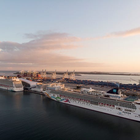 The Norwegian Pearl and the Norwegian Getaway cruise ships are seen docked in Miami, Florida on January 5, 2022.