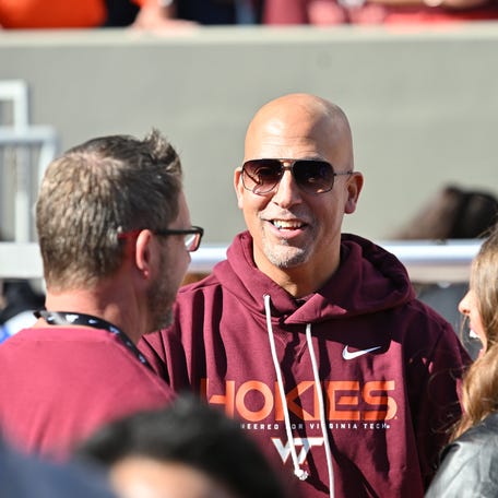 Nov 22, 2025; Blacksburg, Virginia, USA; Incoming head coach James Franklin speaks to fans on the sideline before the game at Lane Stadium. Mandatory Credit: Brian Bishop-Imagn Images