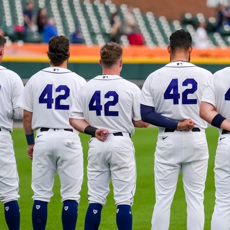 Members of the Detroit Tigers observe the national anthem while sporting the number 42 before the game against the Kansas City Royals at Comerica Park on April 15, 2026, in Detroit, Michigan. All players are wearing the number 42 in honor of Jackie Robinson Day.