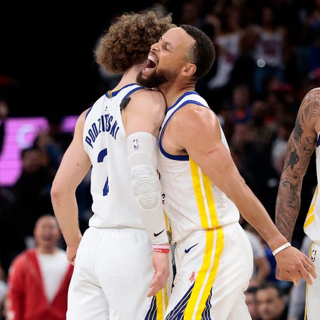 INGLEWOOD, CALIFORNIA - APRIL 15: Stephen Curry #30 of the Golden State Warriors reacts with Brandin Podziemski #2 after a three-point shot against the LA Clippers to go up 120-117 in the second half of an NBA play-in tournament game at Intuit Dome on April 15, 2026 in Inglewood, California. NOTE TO USER: User expressly acknowledges and agrees that, by downloading and or using this photograph, User is consenting to the terms and conditions of the Getty Images License Agreement. (Photo by Ronald
 Martinez/Getty Images)