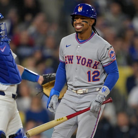 New York Mets shortstop Francisco Lindor (12) reacts to striking out against the Los Angeles Dodgers during the third inning at Dodger Stadium.