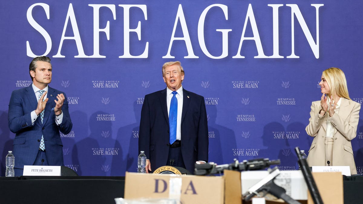 U.S. Defense Secretary Pete Hegseth and then-Attorney General Pam Bondi applaud as U.S. President Donald Trump speaks at a roundtable on public safety at Memphis Air National Guard Base in Memphis, Tennessee, U.S., March 23, 2026.