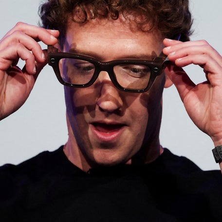 FILE PHOTO: Meta CEO Mark Zuckerberg wears the Meta Ray-Ban Display glasses, as he delivers a speech presenting the new line of smart glasses, during the Meta Connect event at the company's headquarters in Menlo Park, California, U.S., September 17, 2025. REUTERS/Carlos Barria/File Photo