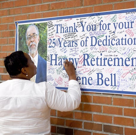 Priscilla Robinson, a member of the South Side Community Advisory Board, signs a poster at a retirement party for Gene Bell, who served as the director of the Asheville Housing Authority, at the Arthur R. Edington Center on July 25, 2019. Robinson worked with Bell to save the building that is now the Edington Center and transform it into a community space. 

Gene Bell Retirement 02