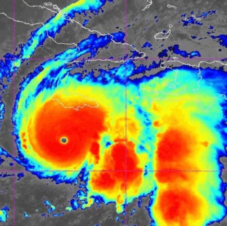 A NOAA satellite image shows the symmetrical eye of Category 5 Hurricane Melissa south of Jamaica, revealing the storm's explosive intensification.