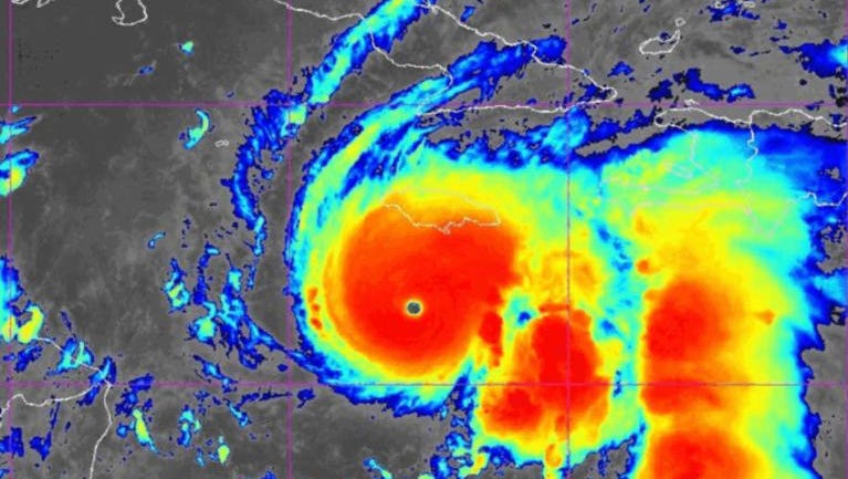 A NOAA satellite image shows the symmetrical eye of Category 5 Hurricane Melissa south of Jamaica, revealing the storm's explosive intensification.