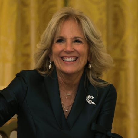Former First Lady Jill Biden waves to members of the press prior to President Joe Biden's Christmas address in the East Room of the White House on Dec. 22, 2022.