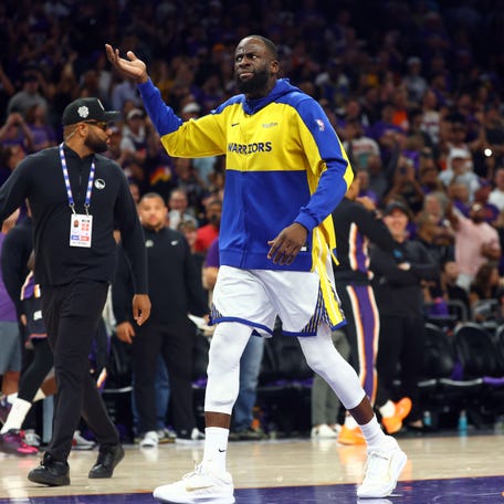 Golden State Warriors forward Draymond Green gestures the crowd after being ejected against the Phoenix Suns.