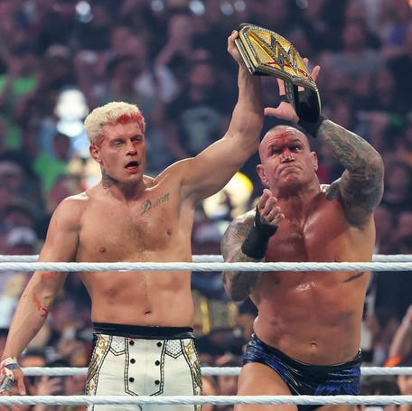 Randy Orton (R) steals the belt from Cody Rhodes (L) during their Undisputed WWE Championship match on night one of WrestleMania 42 at Allegiant Stadium.