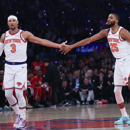 New York Knicks guard Mikal Bridges (25) celebrates with guard Josh Hart (3) after a basket against the Atlanta Hawks during the first quarter.
