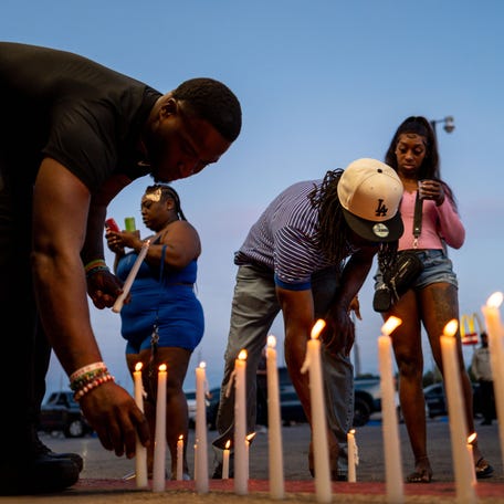 People attend a candlelight vigil on April 19, 2026, in Shreveport, Louisiana, where eight children were fatally shot. Shreveport police said Shamar Elkins opened fire, killing seven of his own children and injuring his wife and another woman.