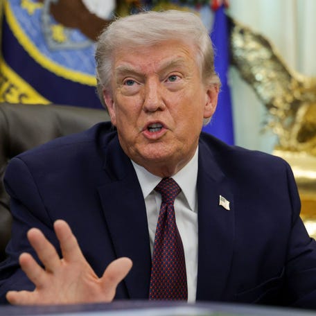 President Donald Trump answers questions after signing an executive order to limit mail-in voting in the Oval Office of the White House on March 31, 2026 in Washington, DC.