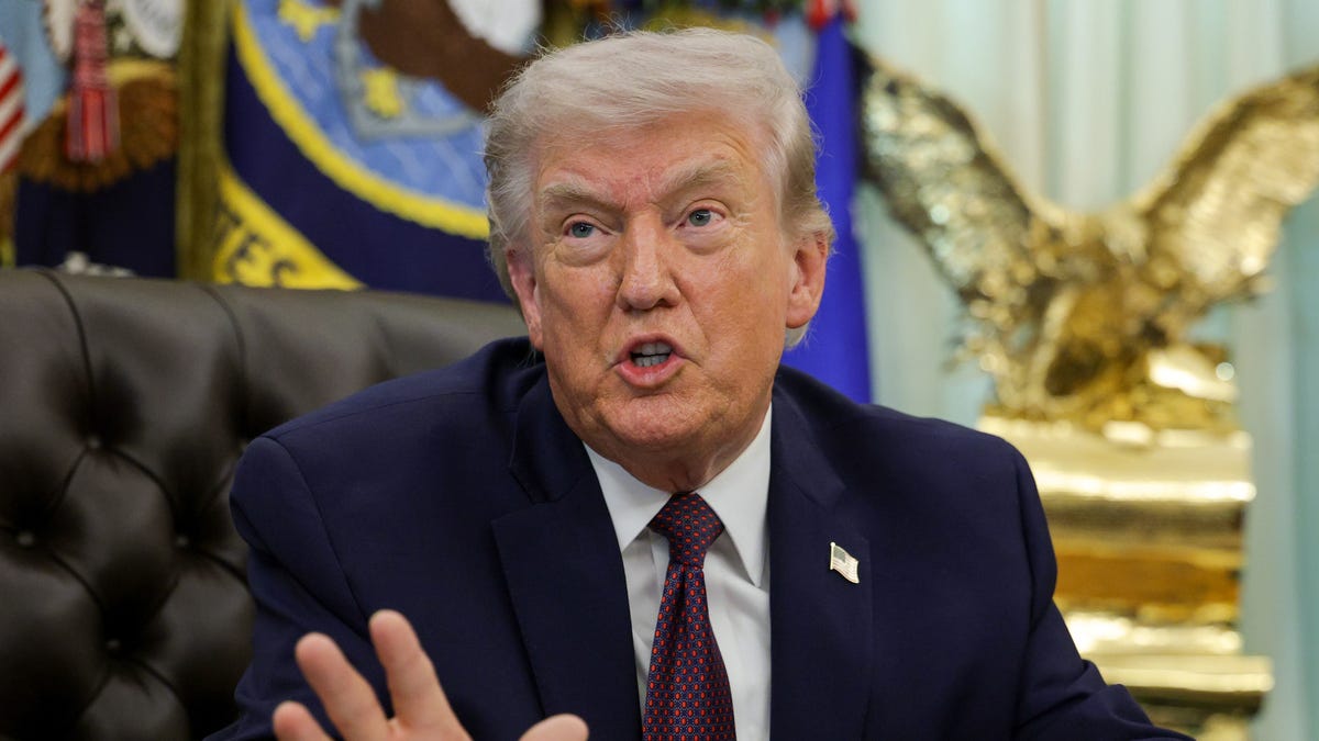 President Donald Trump answers questions after signing an executive order to limit mail-in voting in the Oval Office of the White House on March 31, 2026 in Washington, DC.