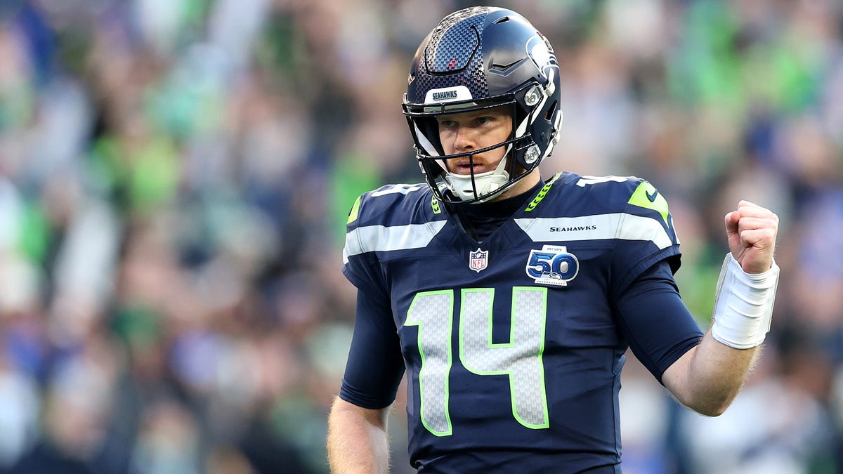 SEATTLE, WASHINGTON - JANUARY 25: Sam Darnold #14 of the Seattle Seahawks celebrates a first quarter touchdown against the Los Angeles Rams in the NFC Championship game at Lumen Field on January 25, 2026 in Seattle, Washington. (Photo by Steph Chambers/Getty Images)