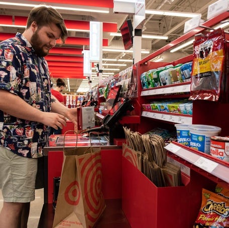 Andy Poppert scans his purchases at the self-checkout at a Target in Doylestown Borough, Pennsylvania on Tuesday, July 16, 2024.