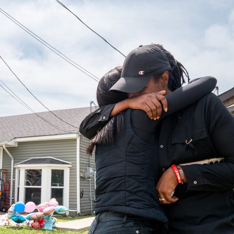People grieve in front of the home where Sunday's shooting spree occurred on April 20, 2026 in Shreveport, Louisiana. Eight children were killed and two women were wounded during a domestic violence incident in the early morning hours on April 19, according to local authorities.