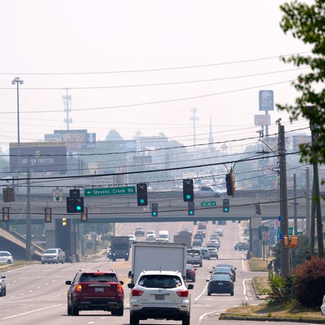 A haze hangs over Washington Road in Augusta, Ga., on Wednesday, April 22, 2026. Richmond and Columbia County have been placed under a burn ban as a large wildfire continues in South Georgia. Mandatory Credit: Katie Goodale - Augusta Chronicle/USA TODAY NETWORK
