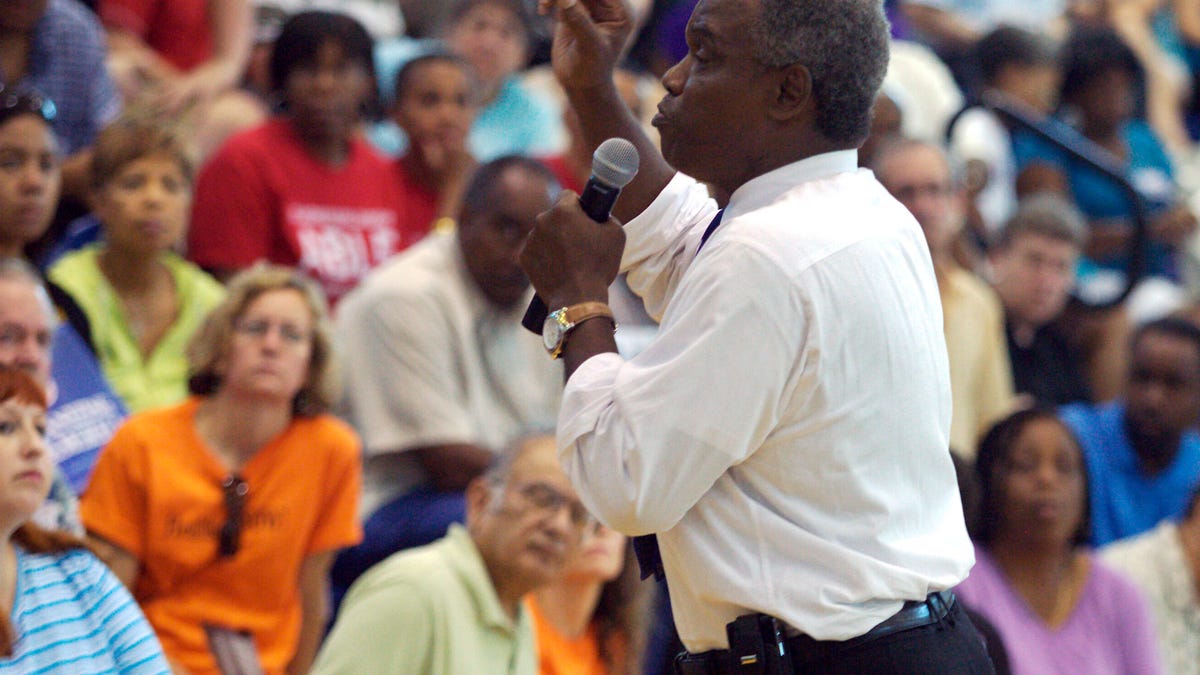 Congressman David Scott (D-GA) addresses the crowd during a townhall meeting on health care reform at Mundy's Mill High School in Jonesboro, Georgia, August 15, 2009.