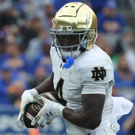 Nov 15, 2025; Pittsburgh, Pennsylvania, USA; Notre Dame Fighting Irish running back Jeremiyah Love (4) runs after a catch against the Pittsburgh Panthers during the second quarter at Acrisure Stadium. Mandatory Credit: Charles LeClaire-Imagn Images