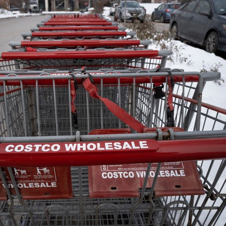 Shopping carts sit in the parking lot of a Costco store on December 02, 2025 in Chicago, Illinois.