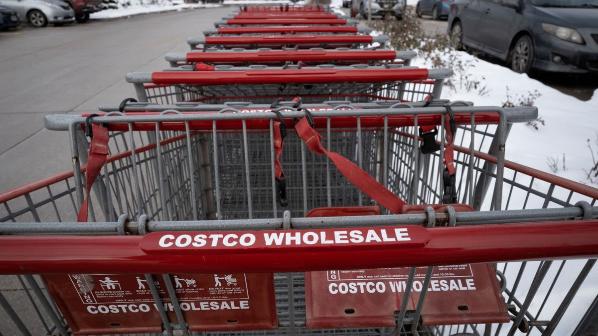 Shopping carts sit in the parking lot of a Costco store on December 02, 2025 in Chicago, Illinois.