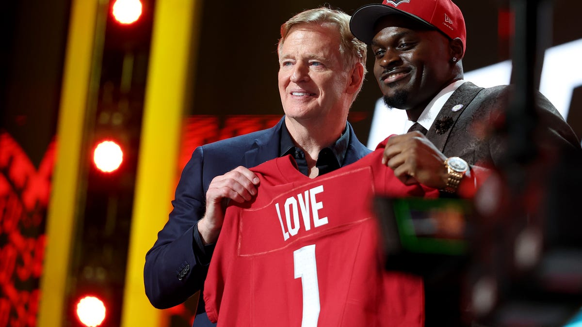 Jeremiyah Love of Notre Dame poses with NFL Commissioner Roger Goodell after being selected third overall pick by the Arizona Cardinals during Round One of the 2026 NFL Draft at Acrisure Stadium on April 23, 2026, in Pittsburgh, Pennsylvania.