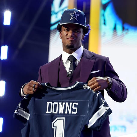 Caleb Downs of Ohio State celebrates after being selected 11th overall by the Dallas Cowboys.