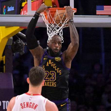Los Angeles Lakers forward LeBron James (23) dunks as Houston Rockets center Alperen Sengun (28) looks on during Game 2 of their first-round playoff series on April 21, 2026.