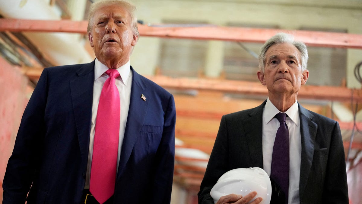 FILE PHOTO: U.S. President Donald Trump and Federal Reserve Chair Jerome Powell speak during a tour of the Federal Reserve Board building, which is currently undergoing renovations, in Washington, D.C., U.S., July 24, 2025.