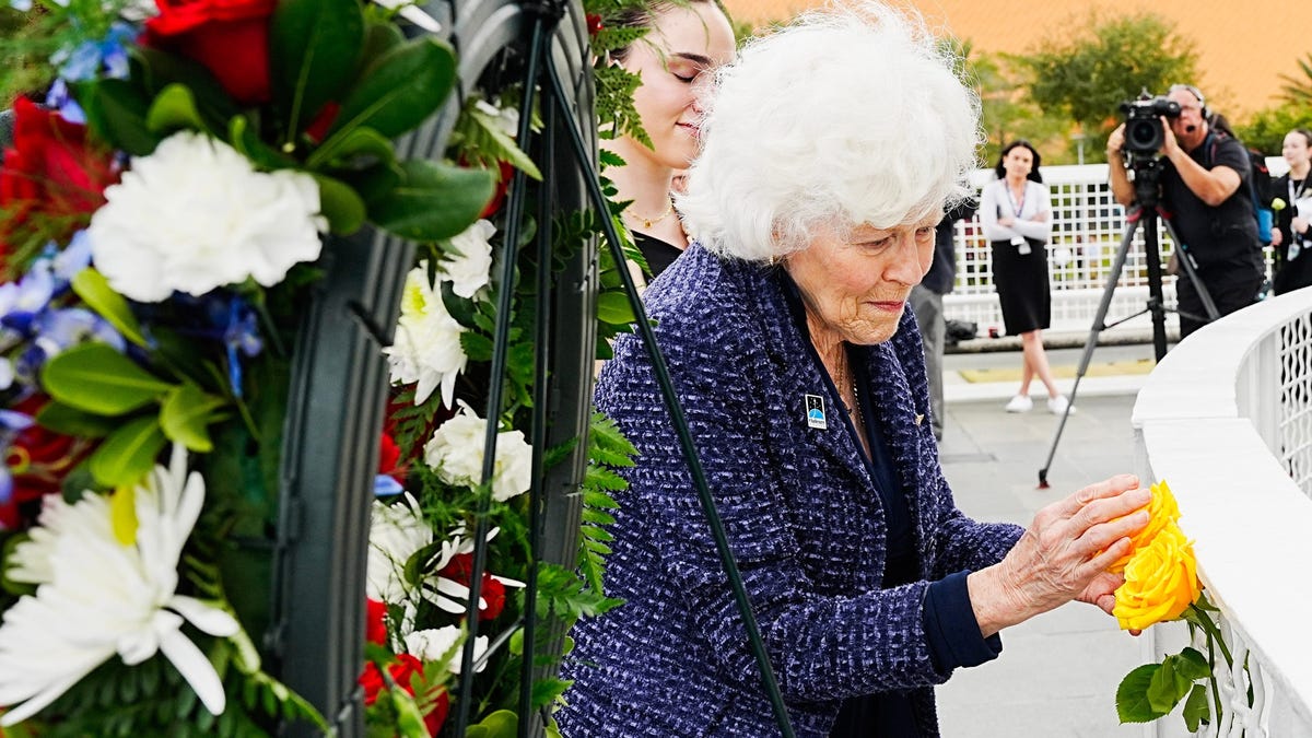 Jane Smith Wolcott, widow of space shuttle Challenger pilot Michael Smith, places a flower iedyr during NASAâ€™s Day of Remembrance at Kennedy Space Center Visitor Complex January 22, 2026. Todayâ€™s Craig Bailey/FLORIDA TODAY via USA TODAY NETWORK