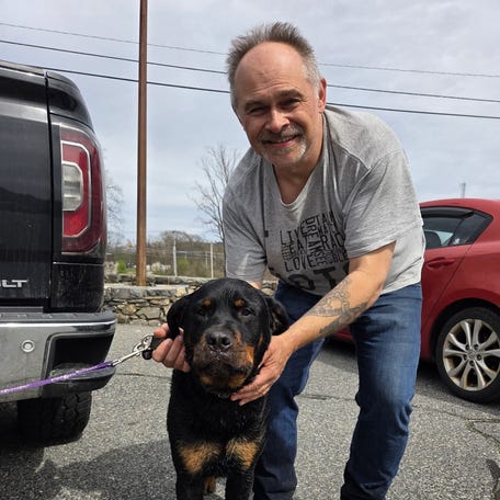 Gregory Lis and Austin, soon after the dog was found in a Grafton pond.