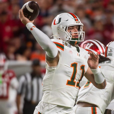 Miami's Carson Beck (11) passes during the College Football Playoff National Championship college football game at Hard Rock Stadium in Miami Gardens on Monday, Jan. 19, 2026.