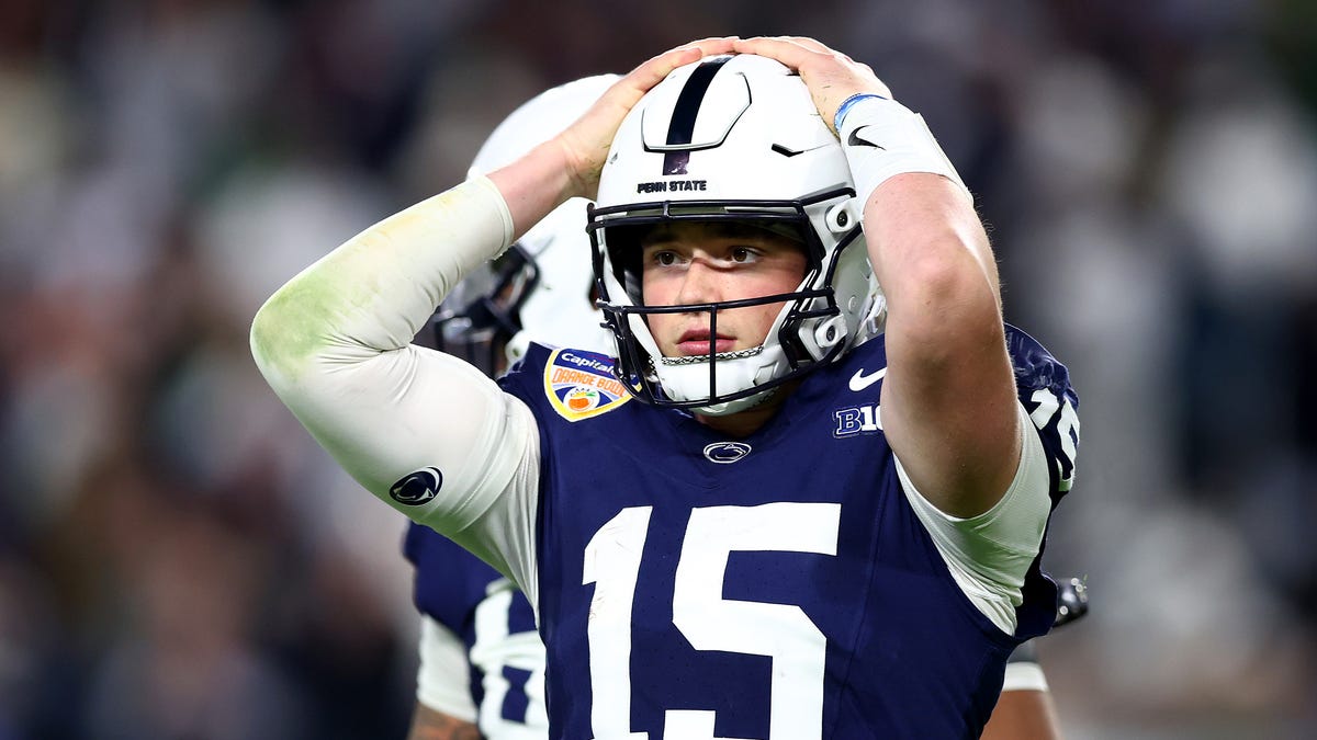 Drew Allar #15 of the Penn State Nittany Lions reacts after throwing an interception during the fourth quarter against the Notre Dame Fighting Irish in the Capital One Orange Bowl at Hard Rock Stadium on January 09, 2025 in Miami Gardens, Florida.
