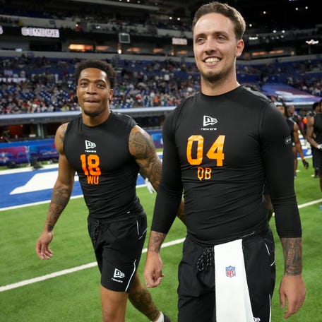 Feb 28, 2026; Indianapolis, IN, USA; Miami wideout CJ Daniels (WO18) walks with Miami quarterback Carson Beck (QB04) during the NFL Scouting Combine at Lucas Oil Stadium. Mandatory Credit: Kirby Lee-Imagn Images