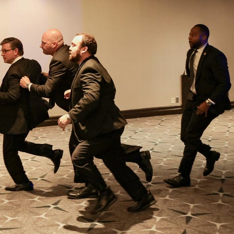 Security officials evacuate U.S. House Speaker Mike Johnson (R-LA) as a possible shooter opens fire during the annual White House Correspondents' Association dinner in Washington, D.C., U.S., April 25, 2026.