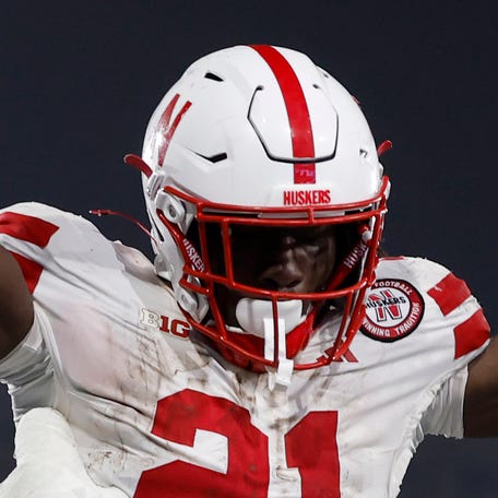 Emmett Johnson (21) of the Nebraska Cornhuskers celebrates his touchdown with Rocco Spindler (50), to take a 28-7 lead, during a 28-21 win over the UCLA Bruins at Rose Bowl Stadium on November 08, 2025 in Pasadena, California.