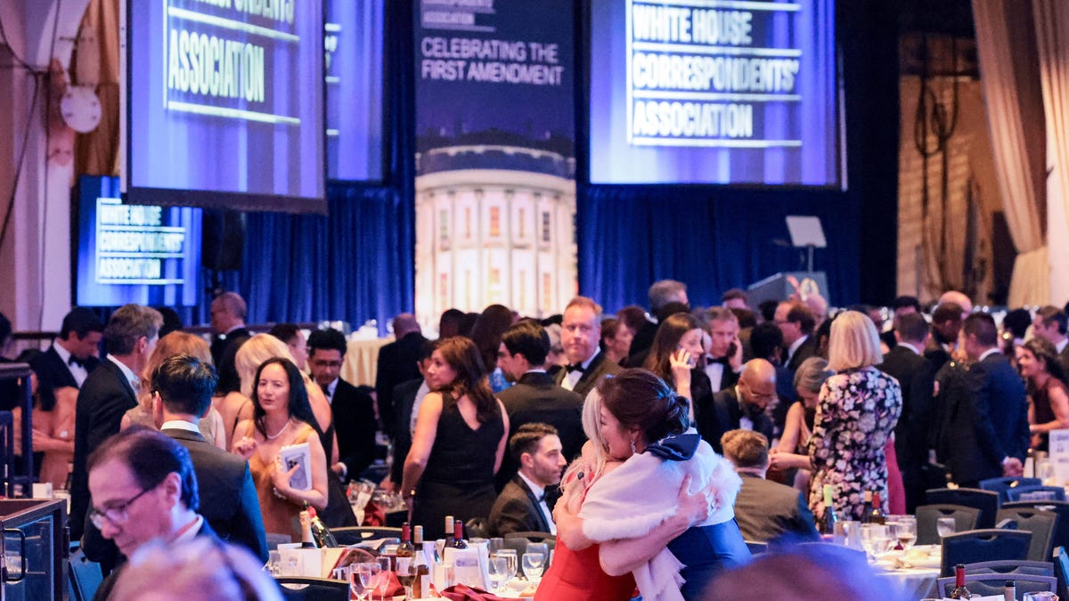 Guests embrace following a shooting incident during the annual White House Correspondents’ Association dinner in Washington, D.C., U.S., April 25, 2026
