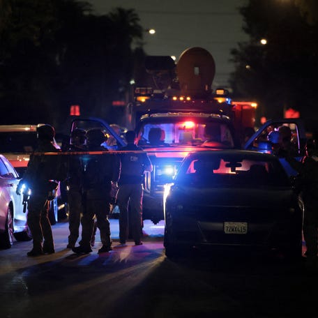 Armed FBI agents operate outside the residence associated with Cole Tomas Allen, the suspect in the shooting incident at the annual White House Correspondents' Association dinner in Washington, D.C., in Torrance, California, U.S., April 25, 2026. REUTERS/Daniel Cole