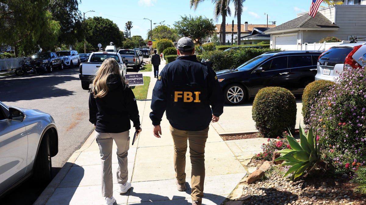 Members of the FBI inspect the neighbourhood where the house associated with Cole Tomas Allen, the suspect in the shooting incident in Washington at the annual White House Correspondents' Association dinner, is located, in Torrance, California, U.S., April 26, 2026. REUTERS/David Swanson