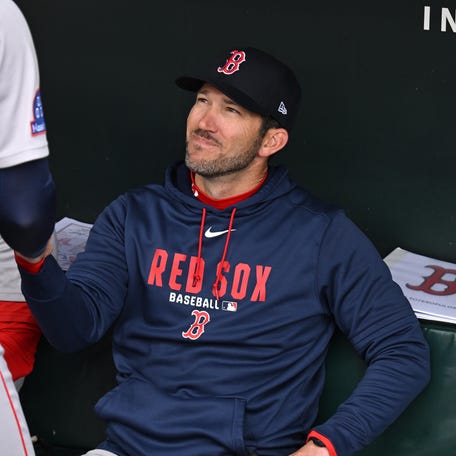 Chad Tracy greets Marcelo Mayer.