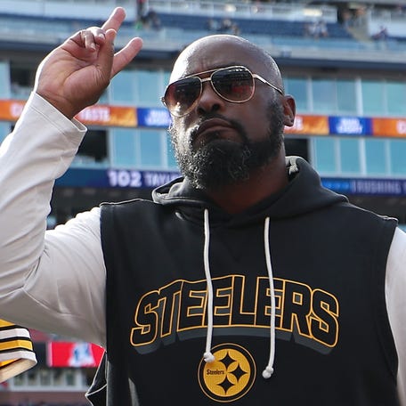 Cameron Heyward (97), Aaron Rodgers (8) and head coach Mike Tomlin of the Pittsburgh Steelers walk off the field after their 21-14 win over the New England Patriots at Gillette Stadium on Sept. 21, 2025.