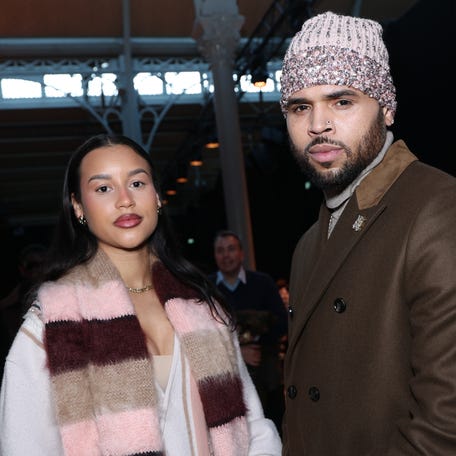 Chris Brown, right, and Jada Wallace attend the Amiri menswear fall/winter 2026-2027 show as part of Paris Fashion Week on Jan. 22, 2026.